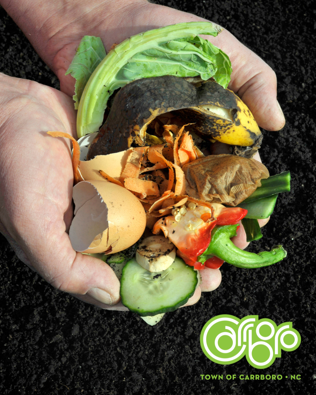 Hands holding composting over soil